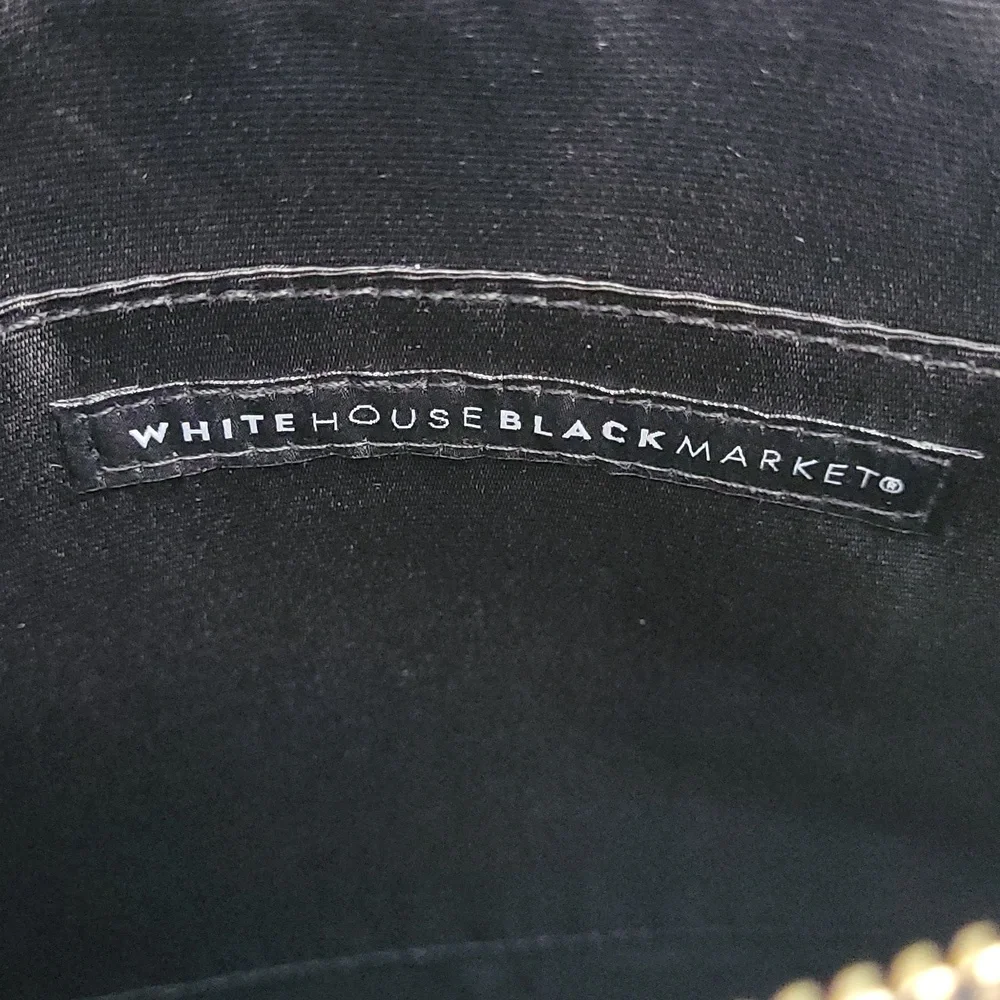 White House Black market Floral clutch